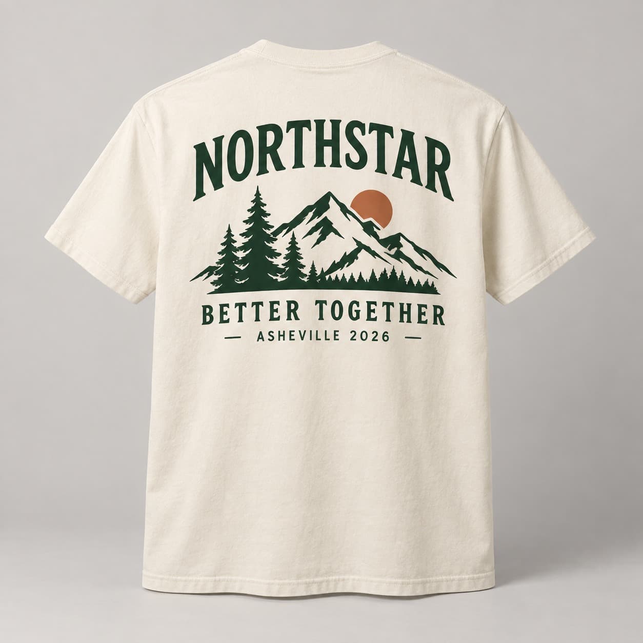 Back of a cream shirt with a forest-green Northstar mountain design and Better Together lettering.